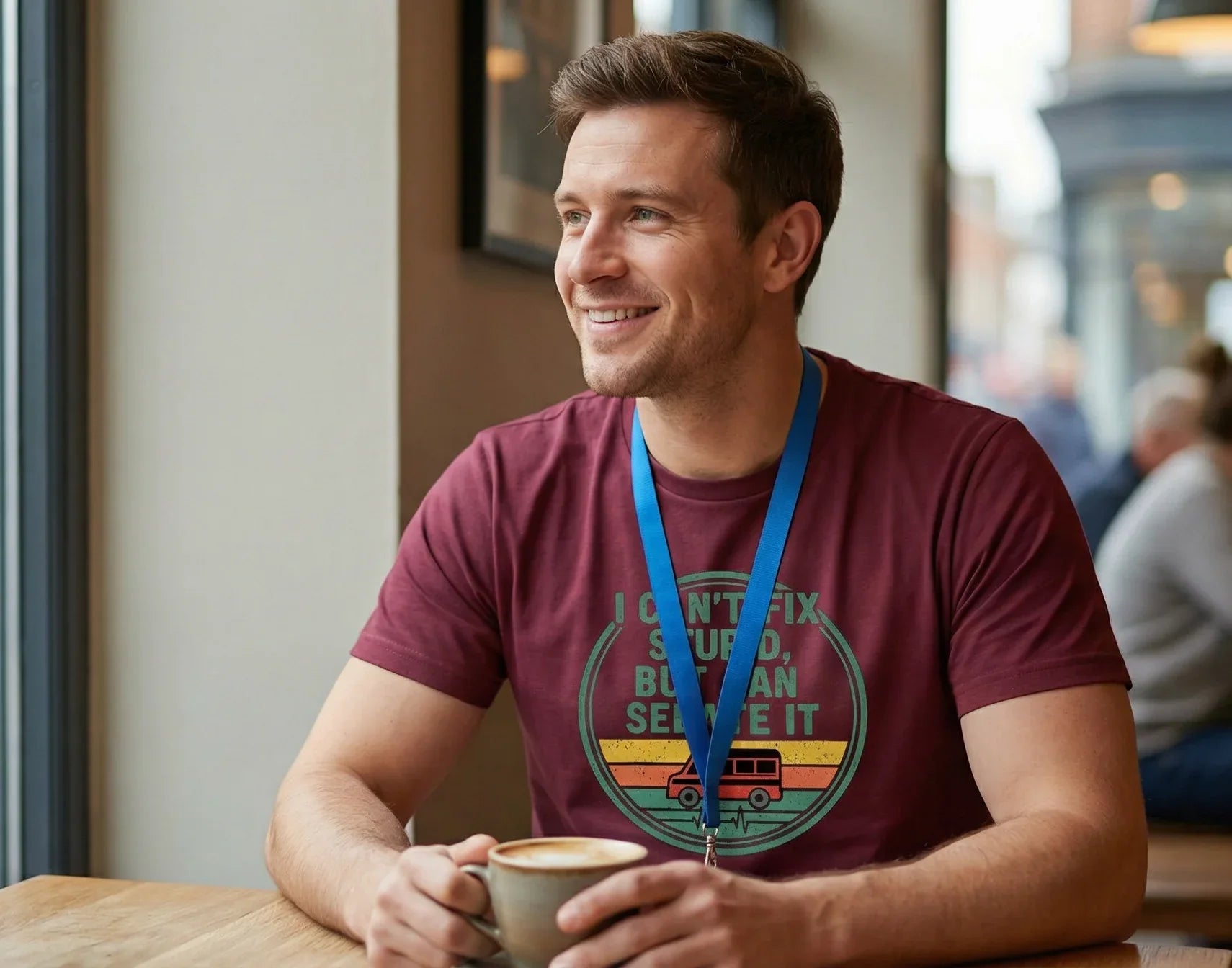 Firefly_Gemini_Flash_1_male_nurse._in_a_coffee_shop_looking_out_of_the_window_smiling._He_is_waiting_for_s_993646 - Tees That Care